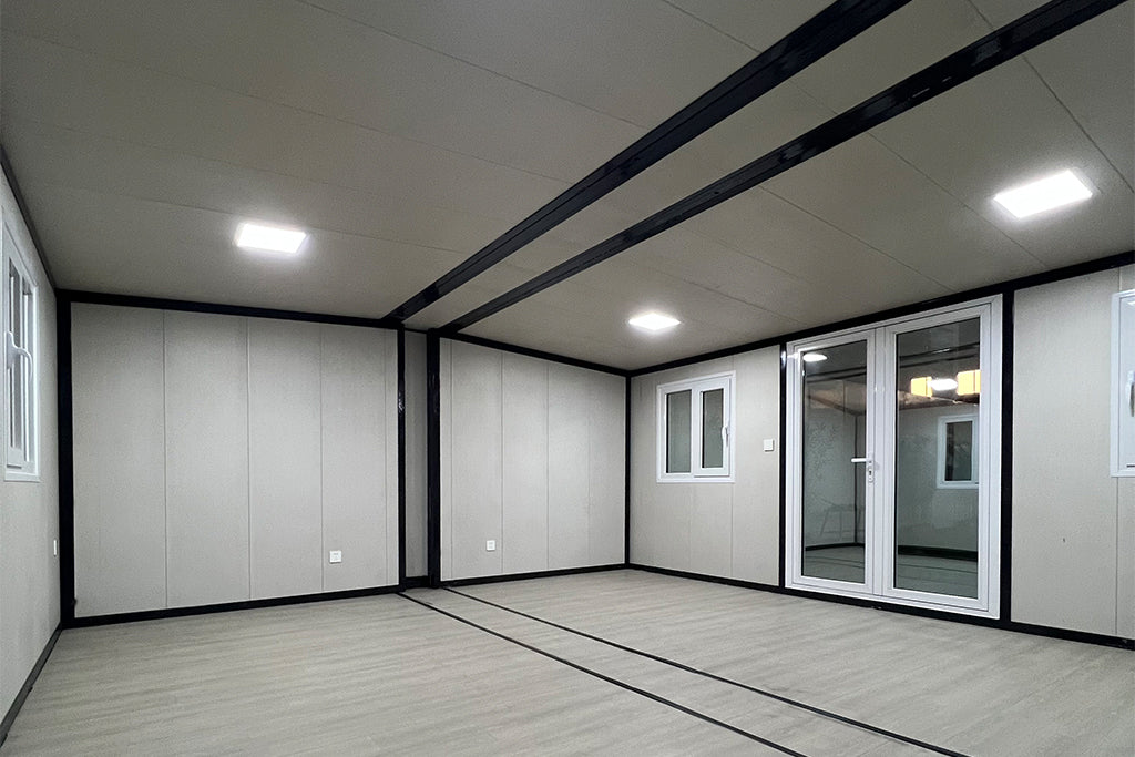 Modern room with white walls, wooden floor, and large sliding glass door.