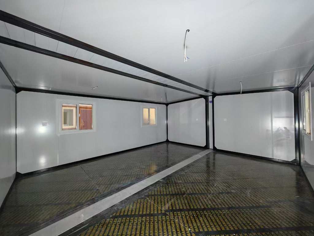 Empty room with white walls and a reflective floor