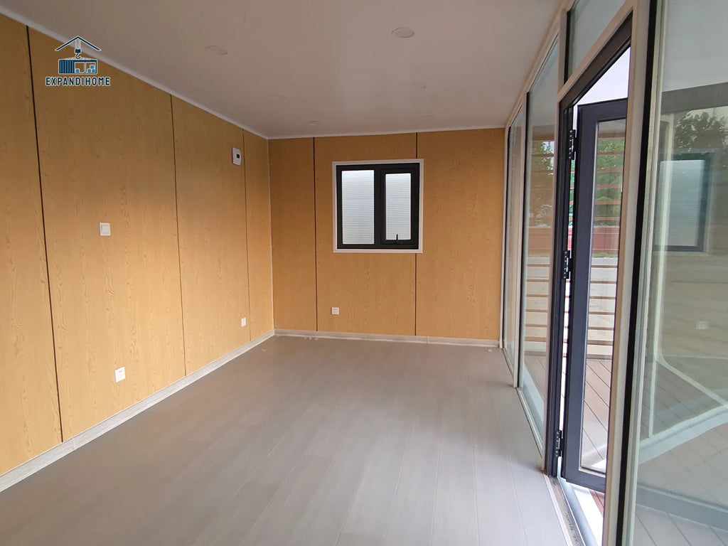 Empty room with wooden walls and a glass door