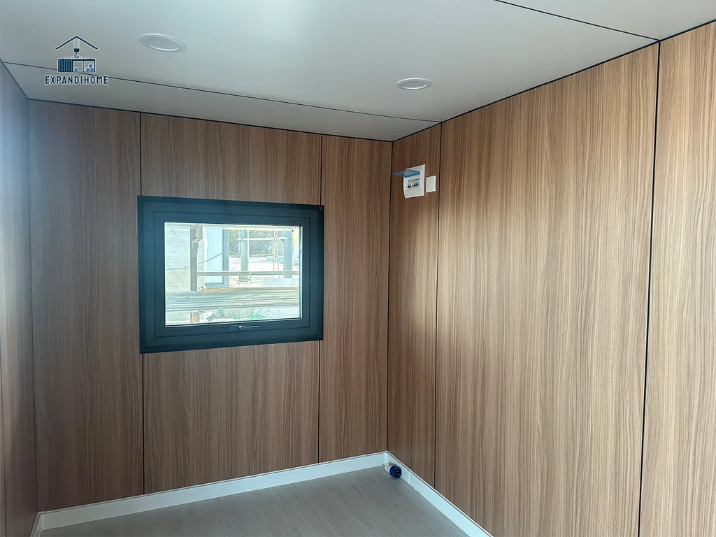 Wood-paneled room with a television mounted on the wall.